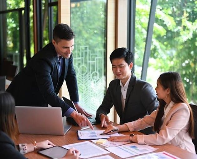 A team reviewing work around a table